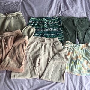 6 pair of kids bottoms, 1 skort, 2 pair of leggings, 3 pair of sweatpants. Sizes